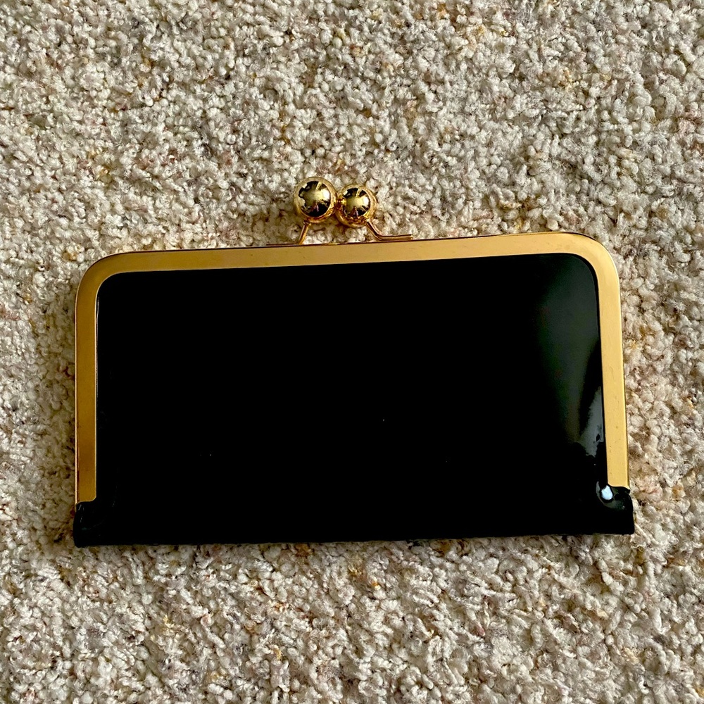 Patton leather black clutch with gold.